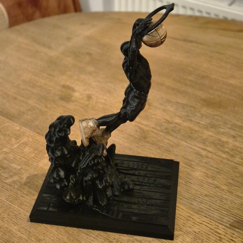 Basketball Player Slam Dunks in the Hoop - Dynamic Sports Statue